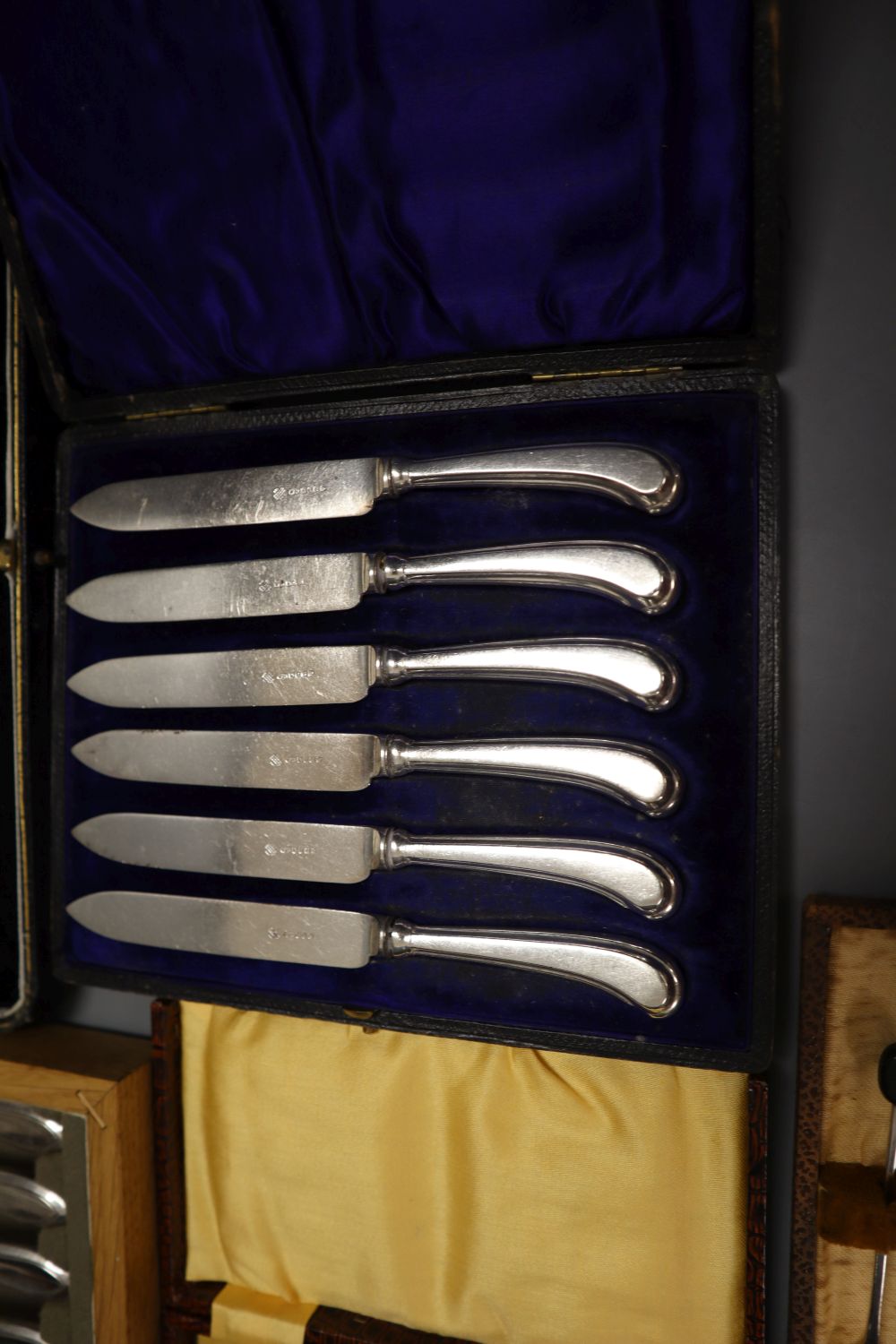 Five cases of plated cutlery.